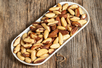 Brazil walnut on wooden background. Close-up brazil walnut kernel