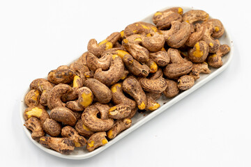 Shelled cashew on white background. Close-up of fresh cashews
