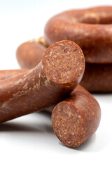 Sausage on a white background. Close-up spicy Turkish sausage