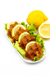 raw meatballs or cigkofte on a white background. Close-up. local name cig kofte