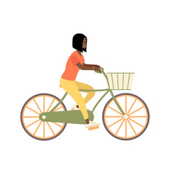 Black woman with short hair riding a bicycle with a basket