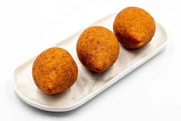 Kibbeh on a white background. Traditional Turkish cuisine delicacies. Close-up. local name icli kofte