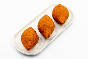 Kibbeh on a white background. Traditional Turkish cuisine delicacies. Close-up. local name icli kofte