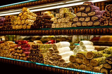 Traditional Turkish delights sweet rolls, Oriental sweets lukum, lokum, nougat.