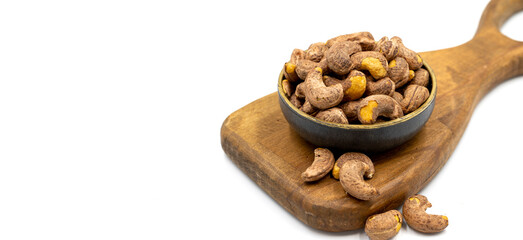 Shelled cashew on white background. Close-up of fresh cashews. Copy space. Space for text