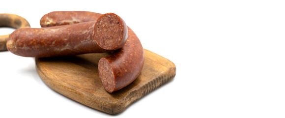 Sausage on a white background. Close-up spicy Turkish sausage. Copy space. Space for text