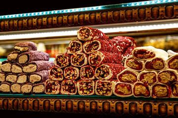 Traditional Turkish delights sweet rolls, Oriental sweets lukum, lokum, nougat.
