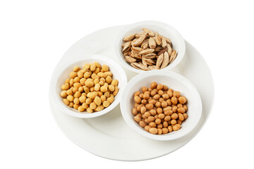 Assorted nuts in white bowls for beer. Isolated on white background.