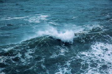 Nature sea abstract background. Foamy waves in the blue ocean