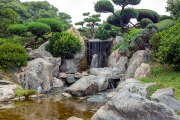 Fototapeta na wymiar beautiful waterfall in japanese style park