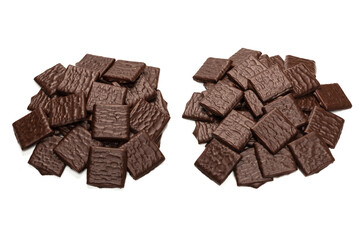 Dark chocolate candies isolated on white background.