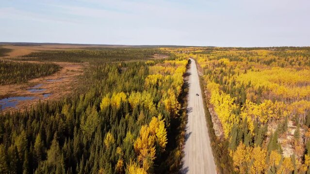 Car driving in desert road of Eeyou Istchee Baie-James Quebec Canada
