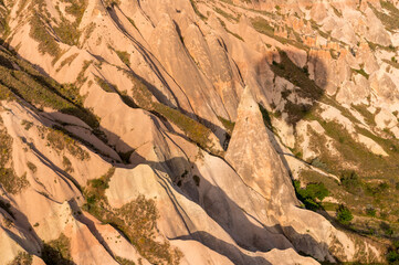 shadow of a hot air balloon above Cappadocia with fairy chimneys