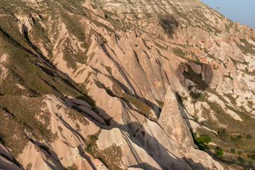 shadow of a hot air balloon above Cappadocia with fairy chimneys