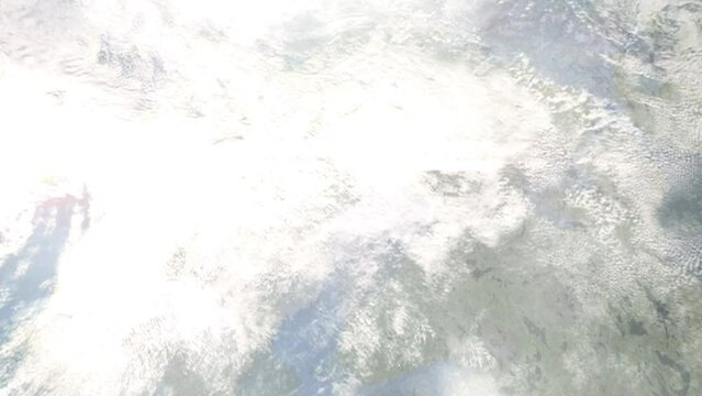 Earth zoom in from outer space to city. Zooming on Lulea, Sweden. The animation continues by zoom out through clouds and atmosphere into space. Images from NASA