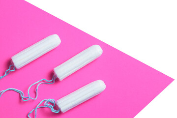 Menstrual period concept. Woman hygiene protection. Cotton tampons on pink background. copy space