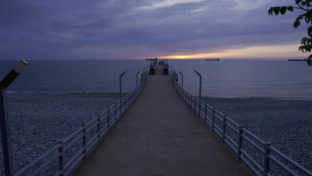 Running girl at Batumi sunset