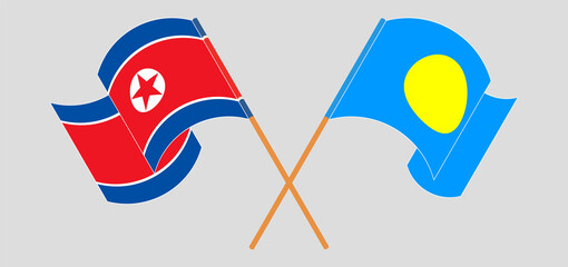 Crossed and waving flags of North Korea and Palau