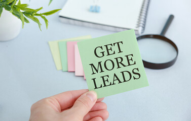 Get More Leads text as memo on notebook with tablet and pen.