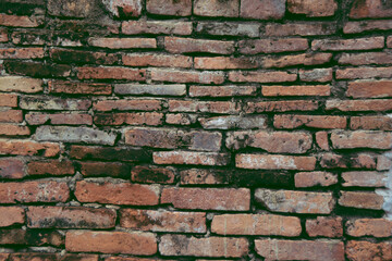 Old red brick wall in the history park.