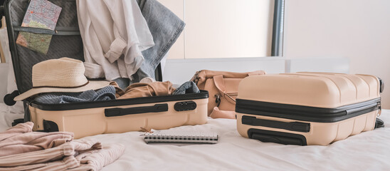 Travel. Staycation.local travel new normal.Girl packing luggage in suitcase and travel documents Travel,tourism,vacation,relocation.Mental health and travel vacation Film grain - Powered by Adobe