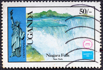 UGANDA - CIRCA 1986: A stamp printed in Uganda with the image Niagara falls, serias Ameriex-86...