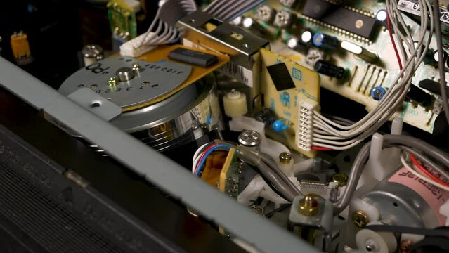 ejection of a cassette from a video recorder, view from the inside, close-up