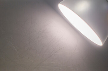 image of light shining on a black gray background