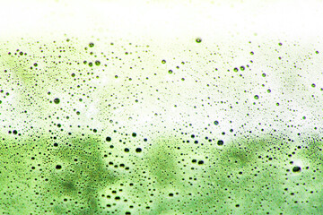 White foam texture. Bubbles burst and spread. The chemical liquid boils and hisses. Toxic poison and chemistry