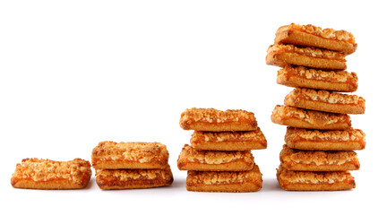 Orange cookies. Cookies with orange filling . The rising towers of orange cookies are isolated on a white background .