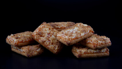 Orange Cookies. Cookies with delicious orange filling on a dark background. close up
