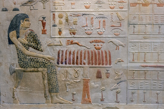 Ancient Egyptian hieroglyphs carved on sandstone