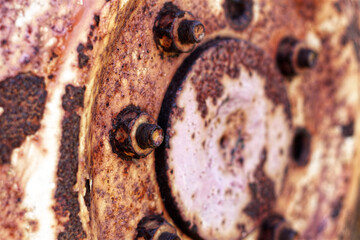 Rusty hub of tractor wheel close up background - horizontal