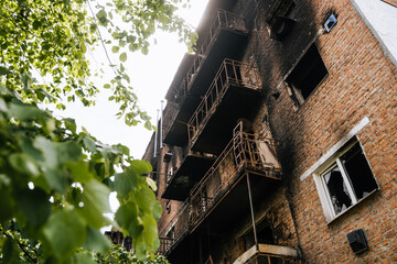 War in Ukraine. A burnt civilian house from the Russian military in the occupied city of...