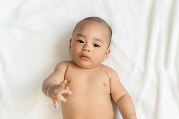 Asian Baby in bed room