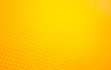 Light orange bright honeycomb abstract soft simple background texture, yellow backdrop, smooth wallpaper, shallow depth of field, full frame. Tech, modern technology background, copy space, nobody
