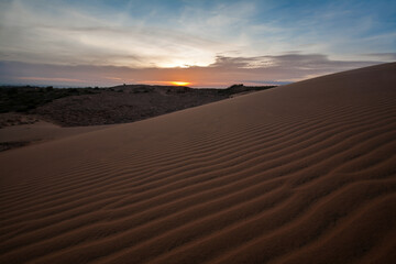 Fototapeta na wymiar Sunset at Red Sand Dune, Desert in Mui Ne, Vietnam