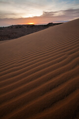Fototapeta na wymiar Sunset at Red Sand Dune, Desert in Mui Ne, Vietnam