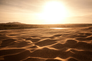 Fototapeta na wymiar Sunset on the desert beach