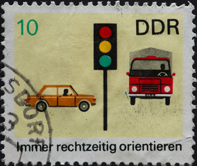 GERMANY, DDR - CIRCA 1969: a postage stamp from GERMANY, DDR, showing a traffic light with cars and...