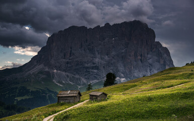 Fototapeta premium Mountains above Val Gardena mountain pass in the Dolomites
