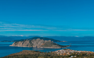 Fototapeta premium From a low peak on the island of Aegina, Greece, we see the town of Perdika, the Moni and Agistri islands, and in the background the Peloponnese.