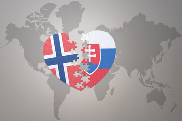 puzzle heart with the national flag of norway and slovakia on a world map background. Concept.