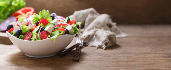 Bowl of fresh salad with vegetables