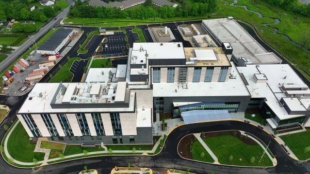 Modern American Hospital Building, New Construction Aerial Reveal. State Of The Art Medical Facility In USA.