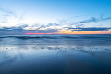 Fototapeta premium Colorful long exposure summer sunset along Oostende (Ostend) North Sea beach, Belgium.