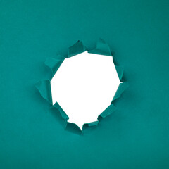 Hole in paper blue background torn damaged for design