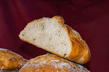 Galician artisan bread cut in half with red bottom, traditional food concept from Galicia (Spain).