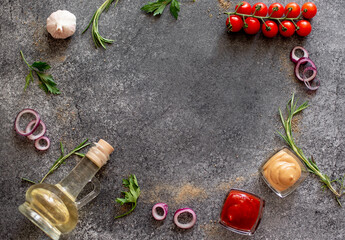 Gray stone background for cooking. Spices and vegetables. View from above. Free space for your text