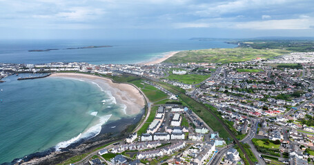 Fototapeta premium Aerial view of Portrush Beach Atlantic Ocean North Coast County Antrim Northern Ireland by Drone